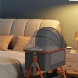TINSY Woodline Pro Baby Bedside Crib with Wooden Finish Pattern & Aluminium Top Rail (Light Grey, Up to 25 kg), Adjustable Height & Anti-Reflux Tilt, Wheels & Rocking Function, Mosquito Net & Storage
