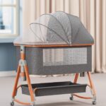 TINSY Woodline Pro Baby Bedside Crib with Wooden Finish Pattern & Aluminium Top Rail (Light Grey, Up to 25 kg), Adjustable Height & Anti-Reflux Tilt, Wheels & Rocking Function, Mosquito Net & Storage